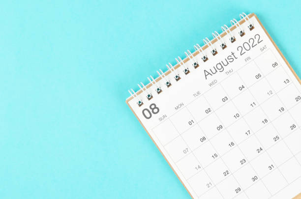istock August 2022 desk calendar on blue background with empty space. 1370701466