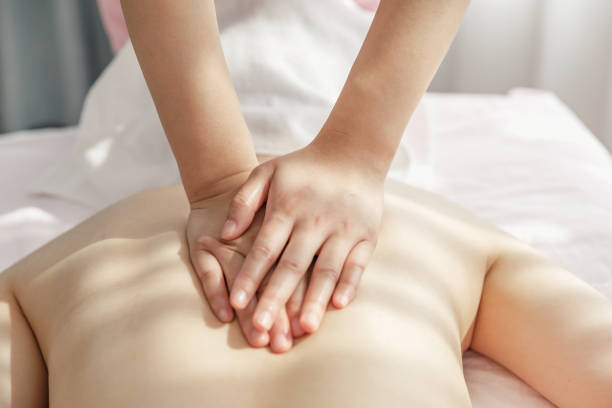 istock A young woman gets a back rub at a SPA. 1370701981