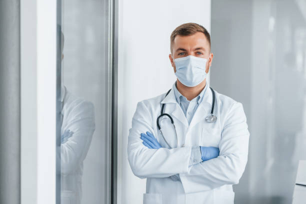 istock Posing for the camera. Professional medic in white coat is in the clinic 1370702109