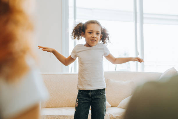 istock Girl interacting with a person at home 1370703214