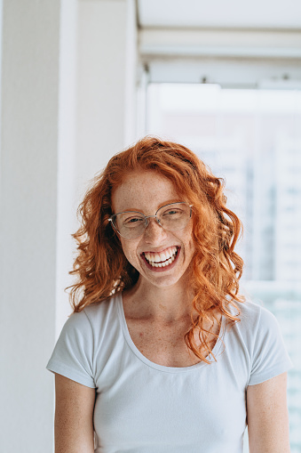 Portrait of smiling a red-haired woman