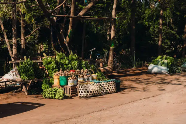 Photo of Authentic African fruit and vegetables market by the road in Tanzania