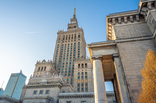 Moscow, Russia - March 31, 2024: High-rise famous Stalin's  skyscraper silhouette on Kudrinskaya Square in Moscow at evening spring sunset, back light, clear blue sky.