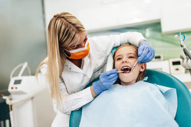 istock Girl at dentist office 1370708668