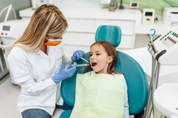 istock Girl at dentist office 1370708683