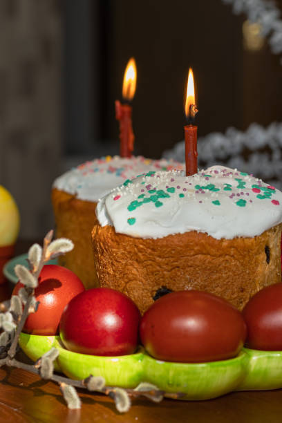 istock Elegant Easter cakes with burning candles on the dining table 1370710425