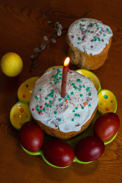 istock Elegant Easter cakes with burning candles on the dining table 1370710427