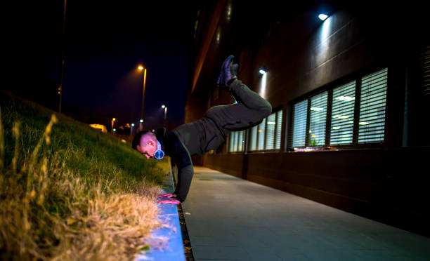 istock Sporty man doing handstand 1370711695