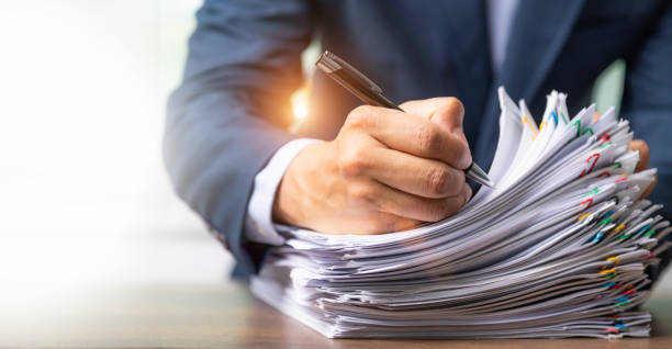 istock Businessman holding documen,  hand writing. 1370711733