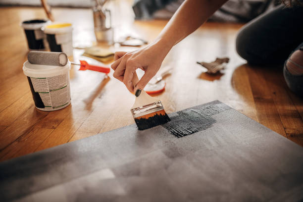 istock Creative female artist painting 1370711864