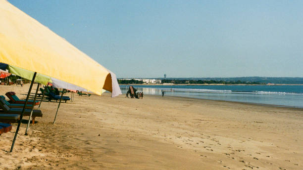 istock Kuta beach panorama with sunbathe 1370712068
