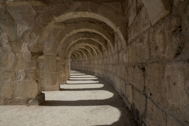 The columned Arch gallery above the auditorium-theatre in the Ancient Roman Theater of Aspendos. Arch in ancient amphitheater.