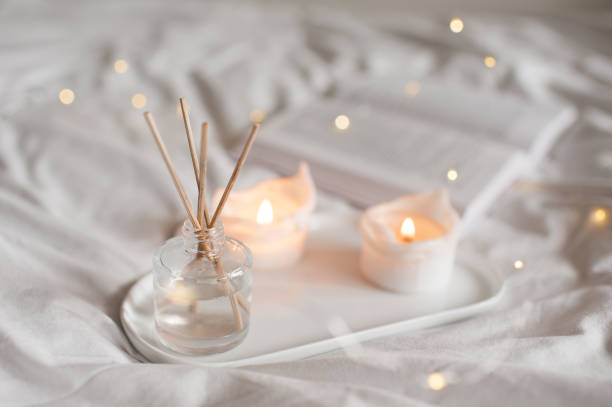istock Home perfume in glass botle in bed 1370718696