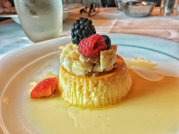 istock Cream caramel custard with black and red berries 1370718710