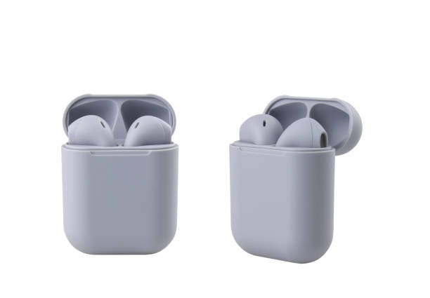 istock Two grey wireless headphones in a case on a white background 1370718740
