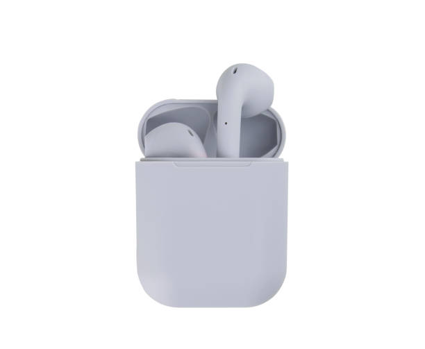 Two grey wireless headphones in a case on a white background