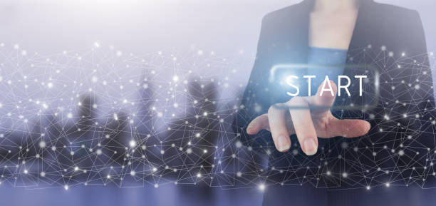 istock New start, beginning business knowledge and innovation newest technology concept. Hand touch digital screen hologram START button sign on city light blurred background. 1370719043