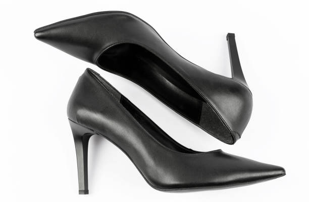 istock black women's high heels on a white floor 1370721231