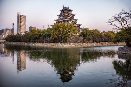 24 march 2019, Hiroshima - Japan: Exterior of Hiroshima castle and his pond at dusk