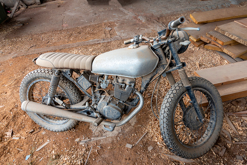 Old Vintage motorcycle in a carpenter's workshop