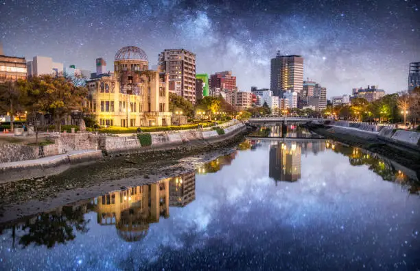 Hiroshima Cityscape at night. View over the Motoyasu River, Atomic Bomb Dome on the left side of the Motoyasu River. Naka Ward, Hiroshima, Japan, Asia.