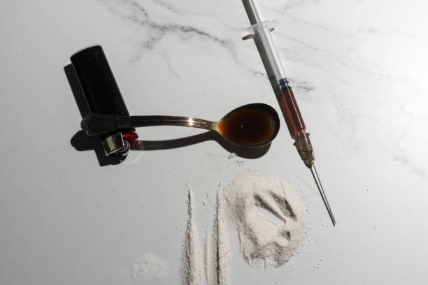 istock Syringes, drugs, heroin, and cooked. 1370724854