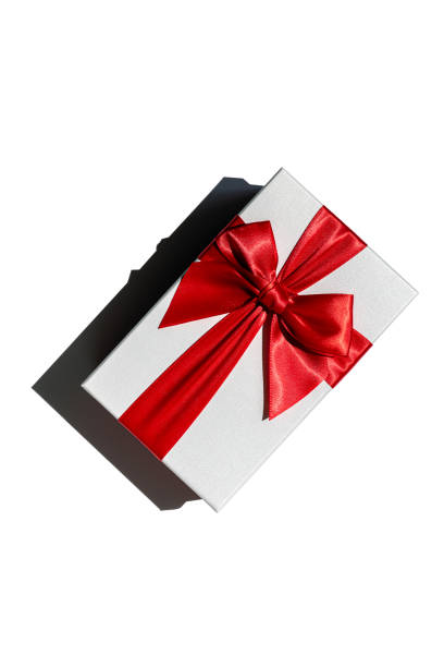 istock Gift box with red ribbon isolated on white from above 1370725883