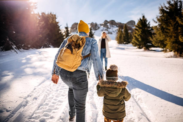 istock Family in a winter walk 1370726484