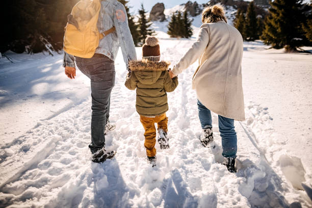 istock Family in a winter walk 1370726502