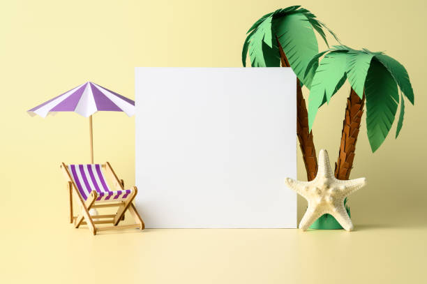 istock Flat white paper blank, and beach accessories on pastel yellow background. Summer Mockup, showcase 1370727355