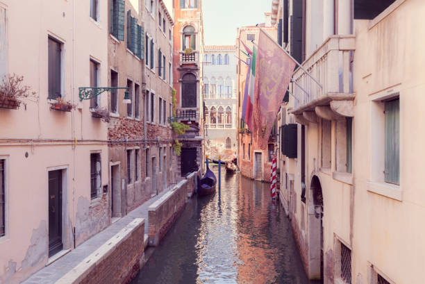 istock narrow canal in Venice with gandola 1370731181