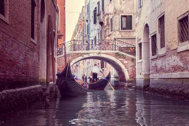 istock The gondolier floats on a narrow canal in Venice 1370731185