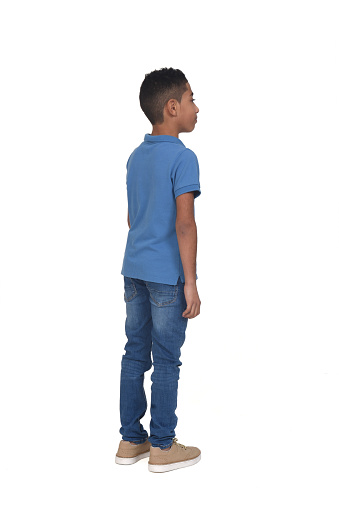 view of boy standing on white background