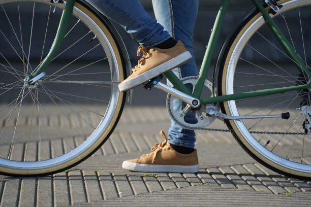 istock Closeup of feet on bicycle 1370733219