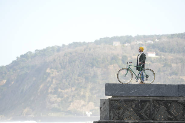 istock Tourist on a wall with bike 1370733793