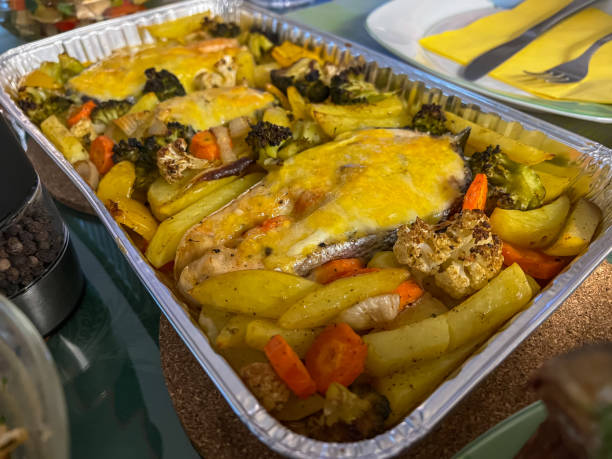 istock Salmon from the oven with cheese, potatoes, carrots and broccoli. 1370734237