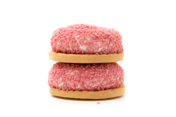 Marshmallows cookies with pink sprinkels on white background.