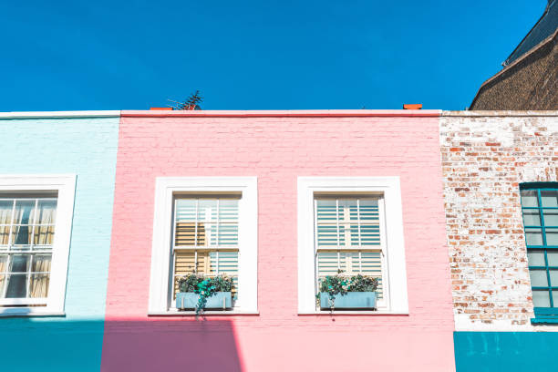 Colorful English houses facades, pastel pale colors in London Colorful English houses facades, pastel pale colors in London kensington and chelsea photos stock pictures, royalty-free photos & images