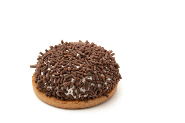 Marshmallows cookies with brown sprinkels on white background.