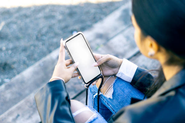 istock Female hands interacting on phone with white screen 1370735890