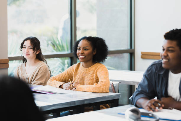 istock Diverse students sitting in classroom listen to unseen teacher 1370735938
