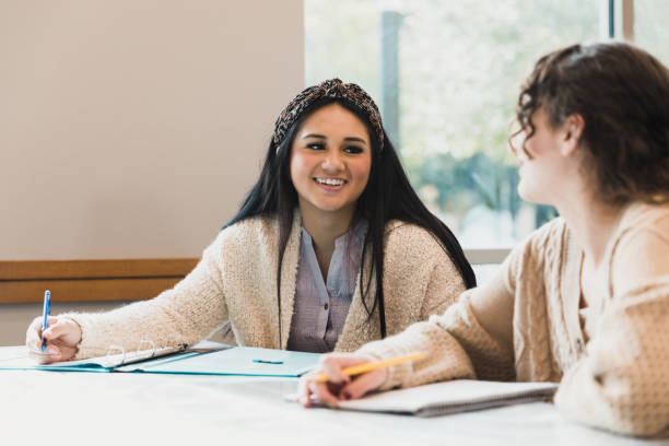 teen girls get to know each other in class - adolescence teenager high school student teenagers only imagens e fotografias de stock