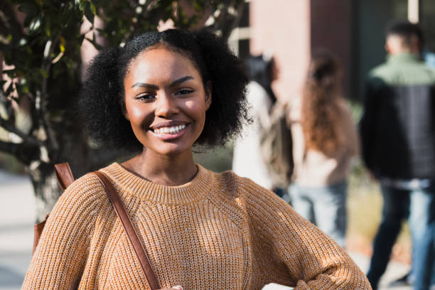 istock Confident college student smiles for camera 1370735984