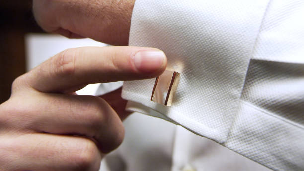 istock The man straightens his brown tie. 1370737242