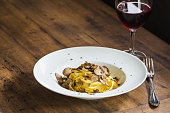 Pasta with truffles.Tagliatelle with fresh truffle on wooden table copy space.