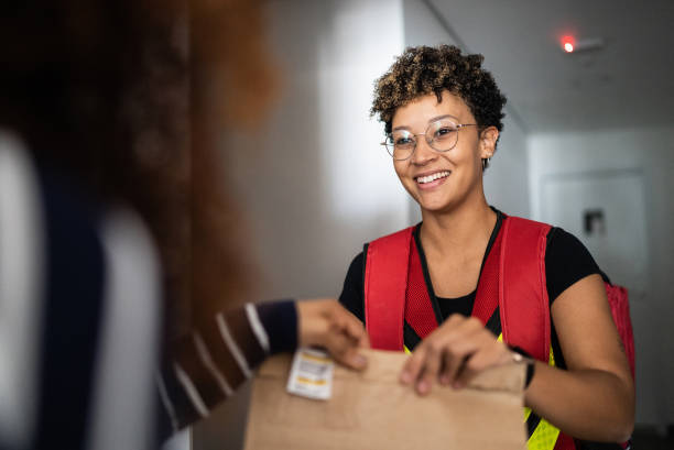 Woman receiving delivery at home