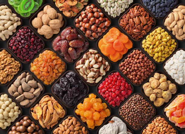 assorted candied berries, dried fruits, nuts and seeds, top view. healthy food background assorted nuts and dried fruits, colorful food background. dried fruit stock pictures, royalty-free photos & images