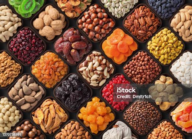 Assorted Candied Berries Dried Fruits Nuts And Seeds Top View Healthy Food Background Stock Photo - Download Image Now