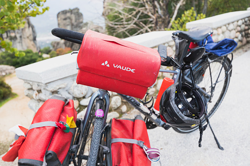 23 October 2021, Meteora, Greece: Mountain bike packed with modern gear and various bags. Concept of cycle equipment and luggage