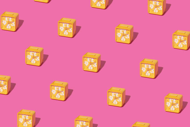 istock Creative pattern made with bright mustard yellow vintage alarm clock on bold pink background. Retro aesthetic style. Minimal time concept. Spring or summer modern layout. 1370742728